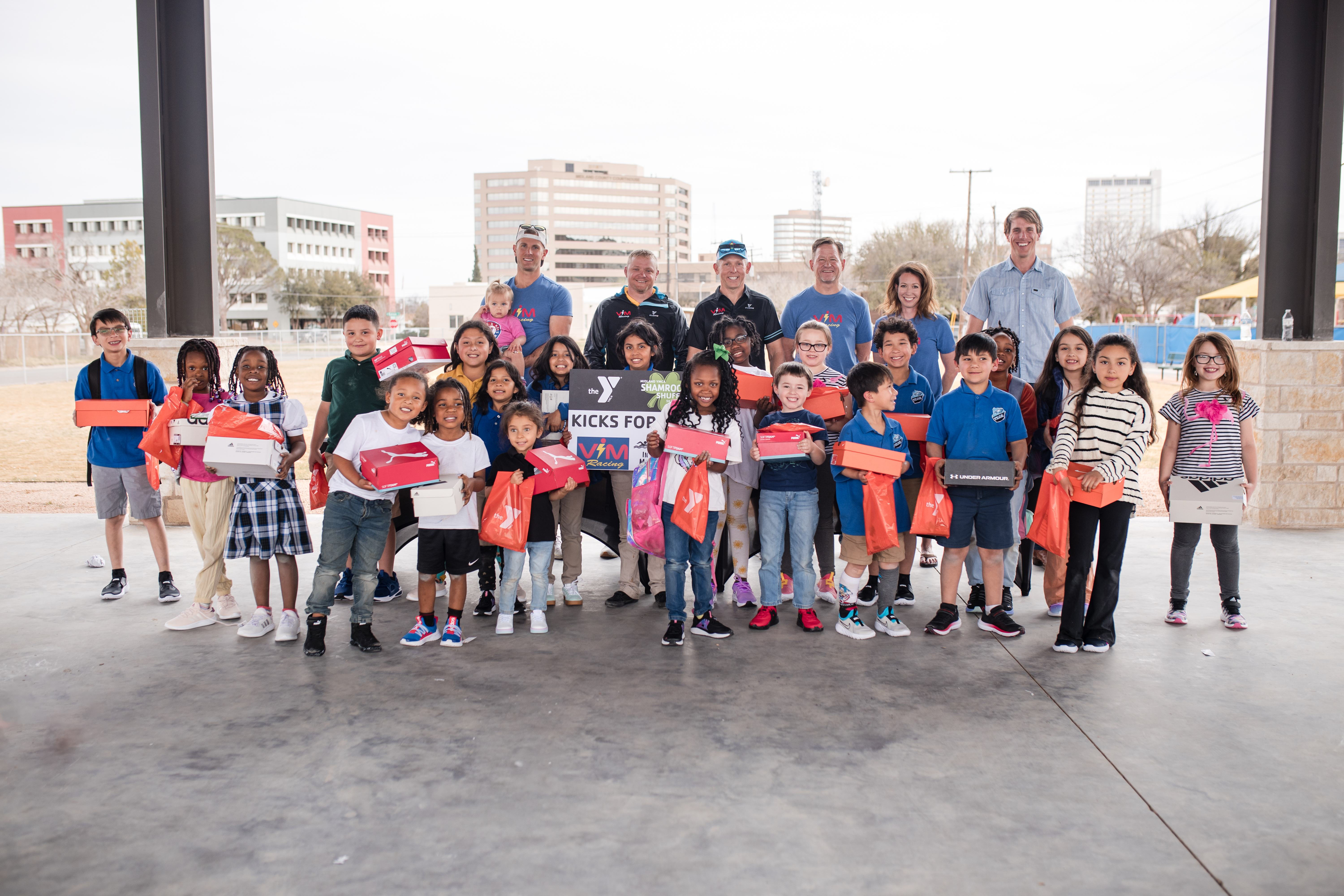 ViM team buying sneakers for kids through their philanthropic work.
